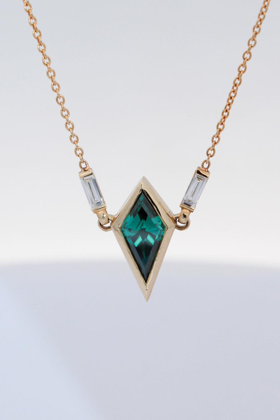 Green moissanite & baguette diamond pendant