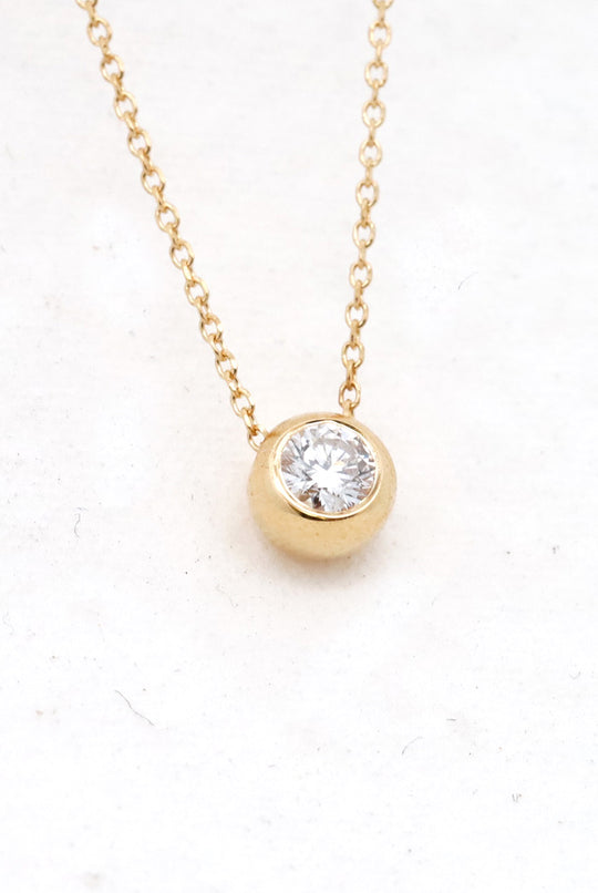 Bezel set diamond pendant