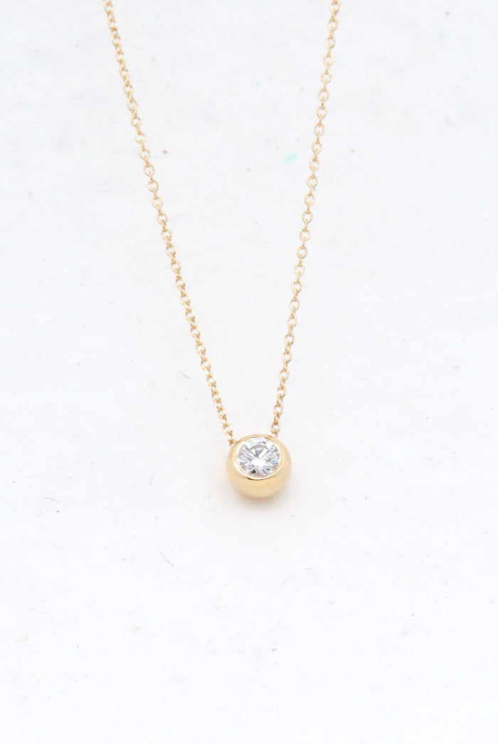 Bezel set diamond pendant