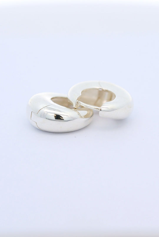 Silver crescent huggie earrings