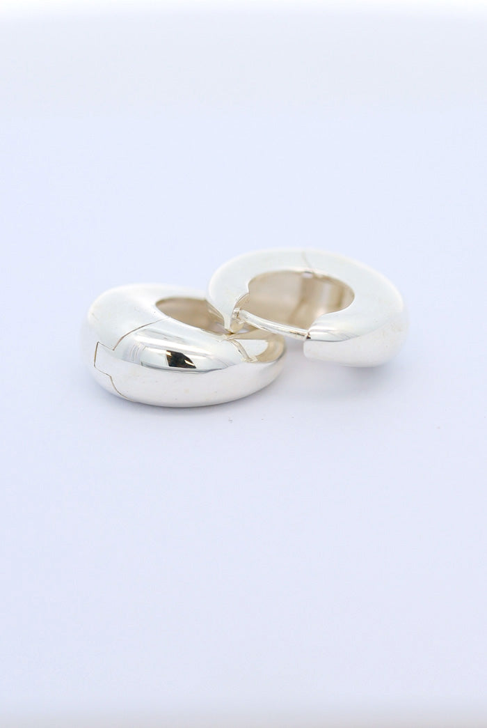 Silver crescent huggie earrings