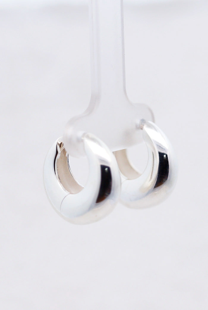 Silver crescent huggie earrings